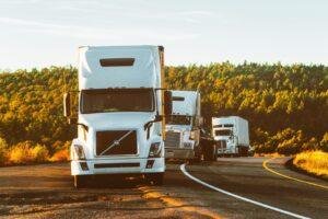 Fleet of trucks on the highway equipped with GPS tracking and real-time monitoring systems