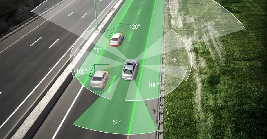 Highway illustration with advanced vehicle detection and monitoring sensors.