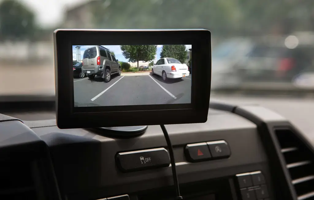 The-image-features-a-compact-car-mounted-camera-similar-to-the-provided-style-recording